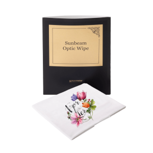 A black and gold Czyścik Sunbeam Optic Wipe VIP (Kopia) box stands behind a white cloth decorated with colorful flowers and the words "for her" in script.